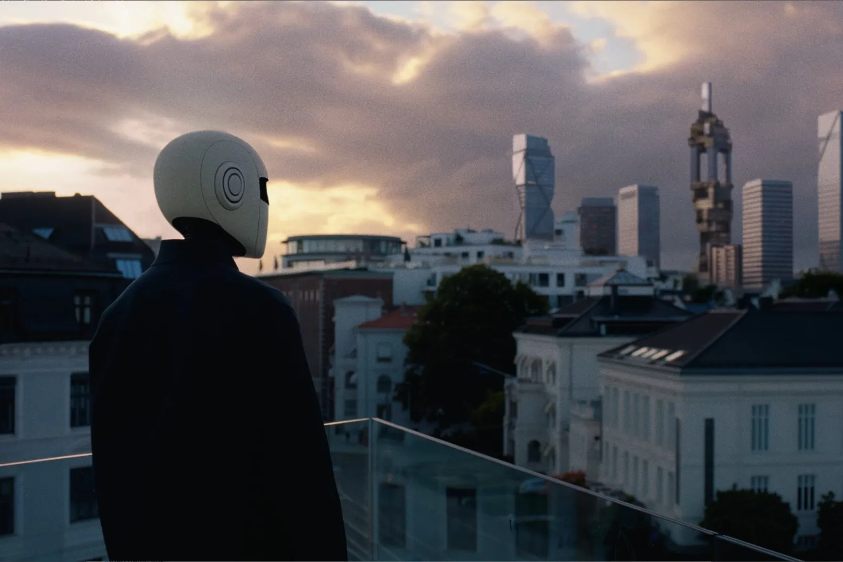 Robot overlooking the city at dusk